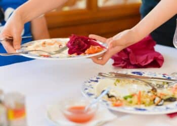 Helping the waiter clear the table reveals deep traits of your character