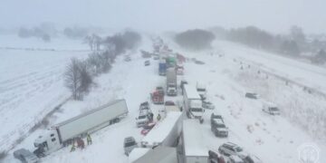 Drivers remain stranded after 100-car pileup caused by heavy snowfall in Michigan
