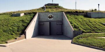 Concrete walls, giant tanks, and impossible doors now surround Mark Zuckerberg, in a work that says more about the future than about technology