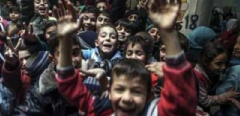 Un grupo de niños de un colegio del barrio Al-Qaboun de Damasco