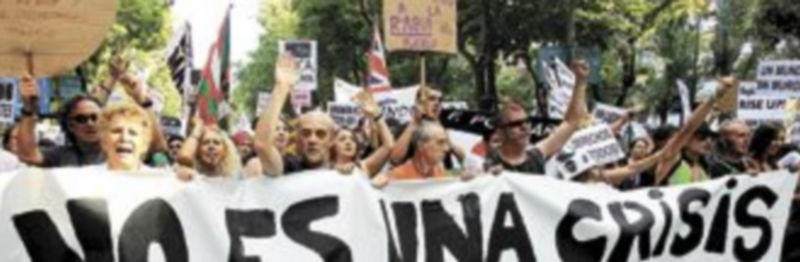 La manifestación estaba encabezada por una pancarta con el lema de la jornada. / Efe