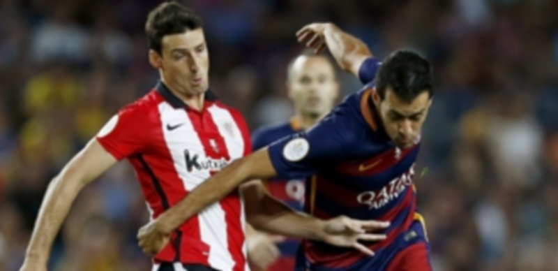 Aduriz (izquierda) y Busquets