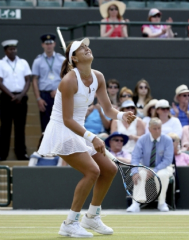 Garbiñe Muguruza celebra el pase a sus primeras semifinales de ‘Grand Slam’. / EFE