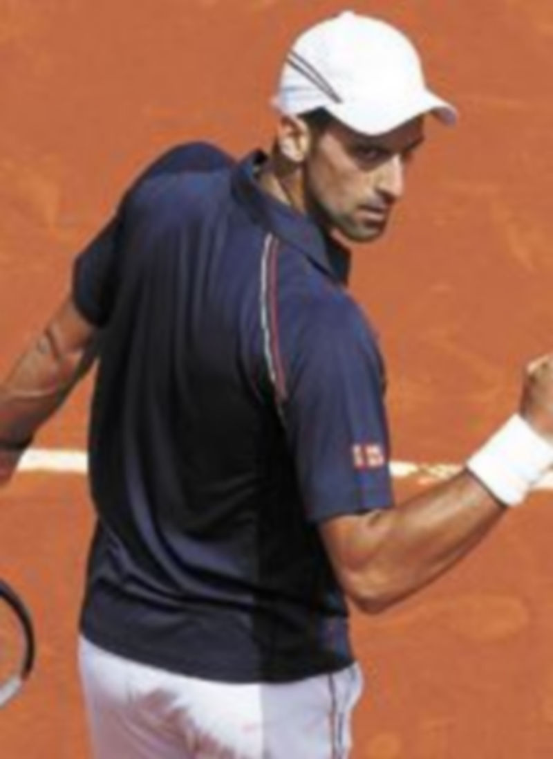 El número uno del mundo festeja su victoria ante el esloveno Blaz Kavcic. / Reuters.