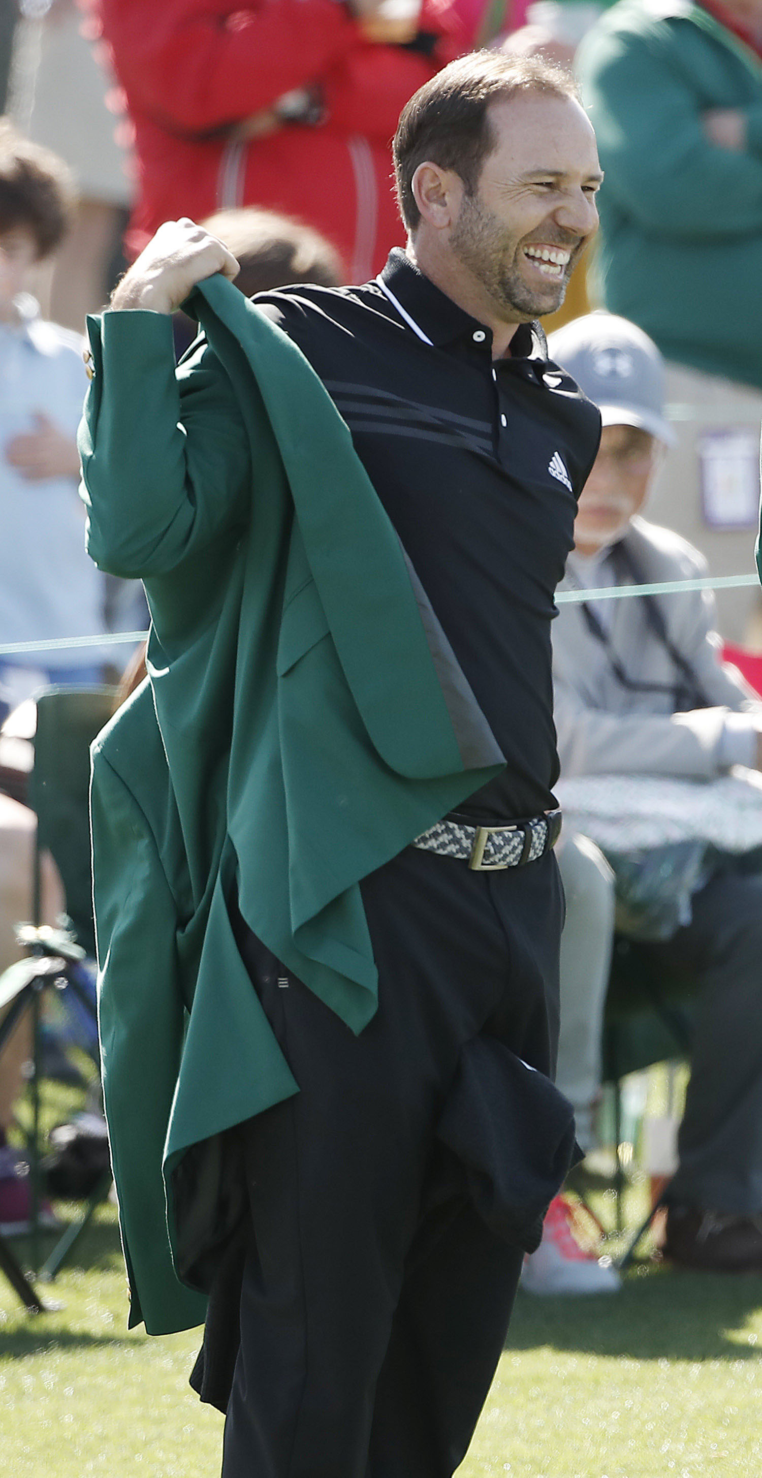 García, con la chaqueta verde.