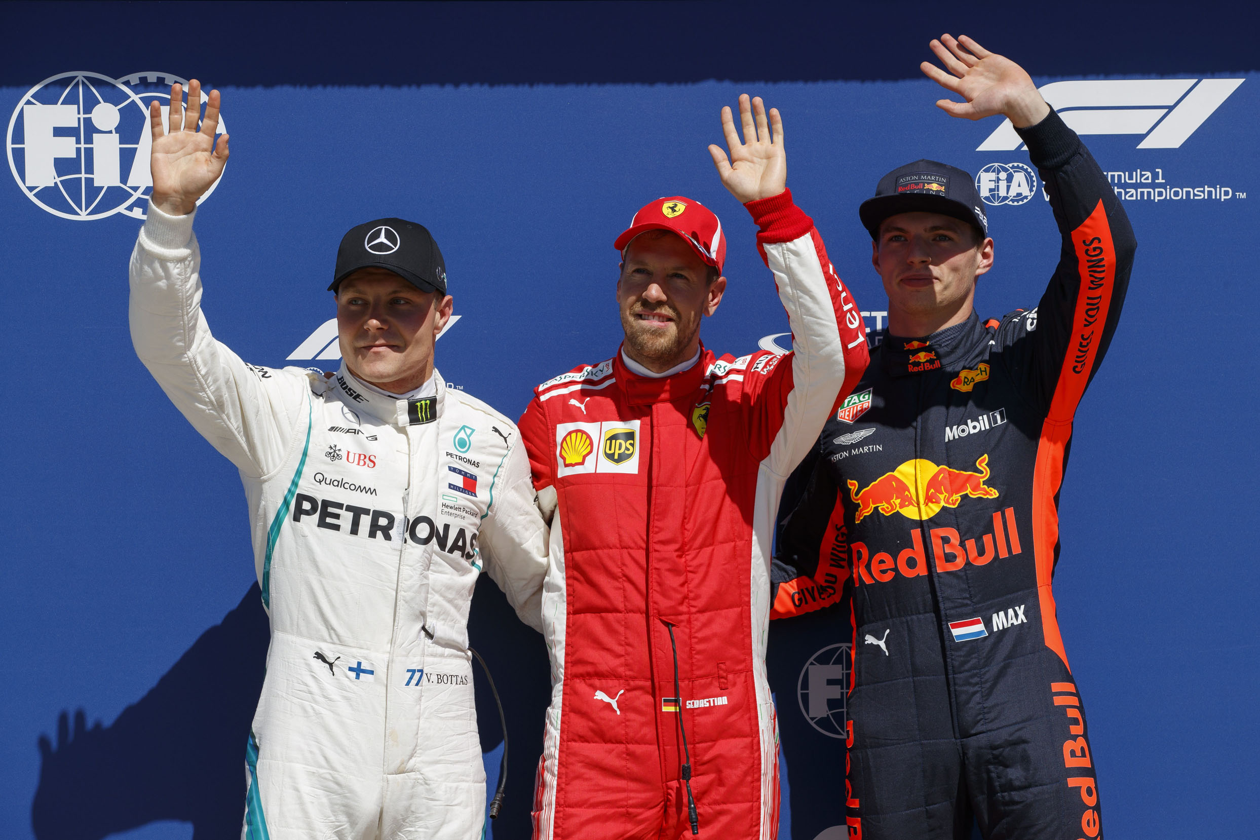 Vettel (centro) logró la pole por delante de Bottas (izq) y Verstappen (dcha).