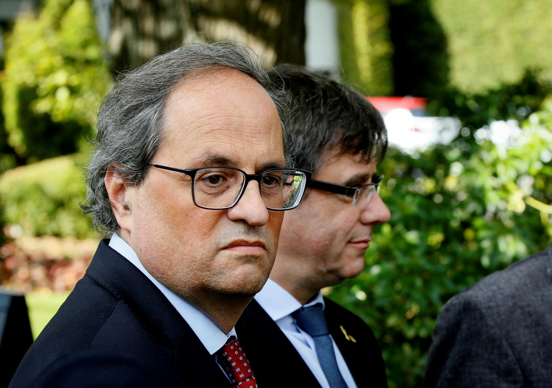 El presidente de la Generalitat, Quim Torra, y su predecesor Carles Puigdemont en la localidad belga de Waterloo.