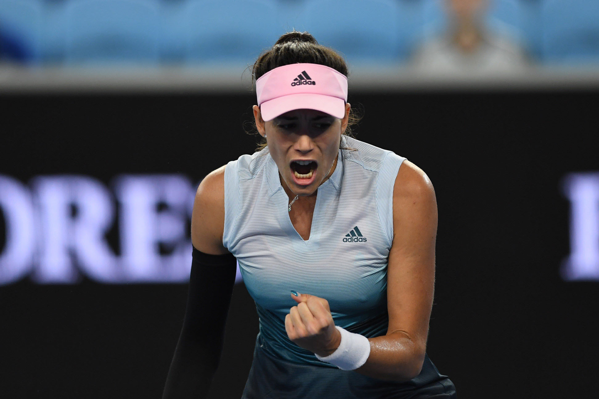 Garbiñe Muguruza celebra su victoria sobre la británica Johanna Konta.