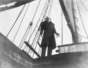 Letra que propulsa el cine 3 Max Schreck en Nosferatu (1922), dirigida por F. W. Murnau.