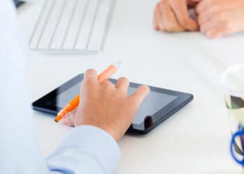 two business woman working office with digital tablet